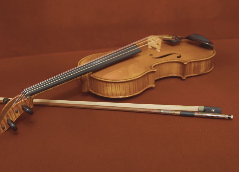 A viola is larger and heavier than the violin
